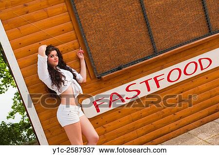 Teenager and fast-food sign View Large Photo Image Stock Photo - Teenager and fast-food sign. Fotosearch