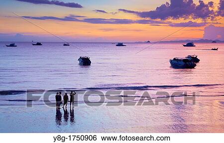 Stock Photograph - Thailand - Krabi province, Phang Nga Bay, sunset time on the beach. Fotosearch