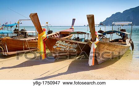 Thailand - Phi Phi Island, Phang Nga Bay, long tail boats at the port View Large Photo Image Stock Photo - Thailand - Phi Phi Island, Phang Nga Bay, long tail boats at the port. Fotosearch