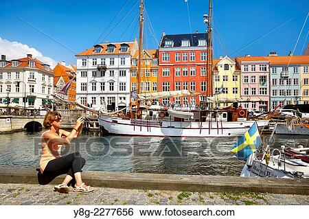 The boat in Nyhavn Canal, Copenhagen, Denmark. View Large Photo Image Stock Photograph - The boat in Nyhavn Canal, Copenhagen, Denmark.. Fotosearch