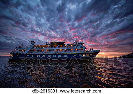The Lindblad Expeditions ship National Geographic Sea Lion at sunset off Isla Ildefonso, Baja California Sur, Mexico. View Large Photo Image Stock Image - The Lindblad Expeditions ship National Geographic Sea Lion at sunset off Isla Ildefonso, Baja California Sur, Mexico.. Fotosearch