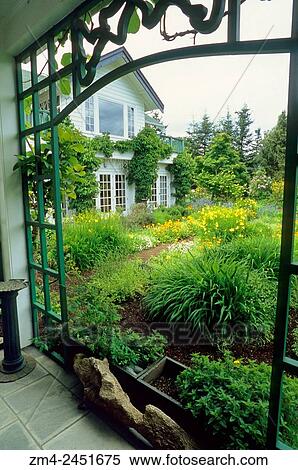 Stock Photography - The Sooke Harbour House and the garden on Vancouver Island in British Columbia, Canada.. Fotosearch