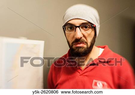 Tilburg, Netherlands. Male, Syrian refugee looking not very happy, while standing next to a printed map of Manhattan, New York. View Large Photo Image Stock Photograph - Tilburg, Netherlands. Male, Syrian refugee looking not very happy, while standing next to a printed map of Manhattan, New York.. Fotosearch