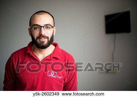 Tilburg, Netherlands. Portrait on location of a Syrian refugee, waiting entlessy for his registration. View Large Photo Image Stock Photo - Tilburg, Netherlands. Portrait on location of a Syrian refugee, waiting entlessy for his registration.. Fotosearch