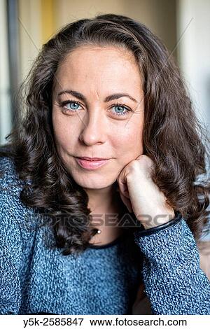 Tilburg, Netherlands. Studio Portrait of a Bulgarian woman with her hear resting on her hand. View Large Photo Image Stock Photo - Tilburg, Netherlands. Studio Portrait of a Bulgarian woman with her hear resting on her hand.. Fotosearch
