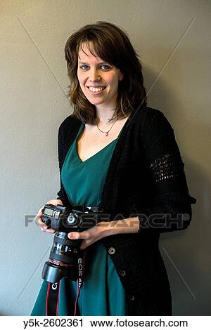Tilburg, Netherlands. Young and attractive female photographer working behind her notebook computer. View Large Photo Image Stock Image - Tilburg, Netherlands. Young and attractive female photographer working behind her notebook computer.. Fotosearch