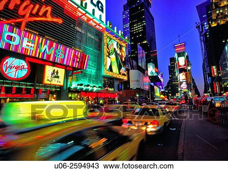 Times Square in New York City at night showing motion blur of taxis View Large Photo Image Stock Image - Times Square in New York City at night showing motion blur of taxis. Fotosearch