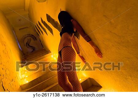 Tiny candles around young woman at midnight View Large Photo Image Stock Photo - Tiny candles around young woman at midnight. Fotosearch