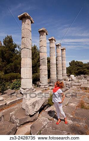Tourist at the Temple of Athena at the ancient city of Priene, Soke, Aydin, Turkey, Europe. View Large Photo Image Stock Photography - Tourist at the Temple of Athena at the ancient city of Priene, Soke, Aydin, Turkey, Europe.. Fotosearch