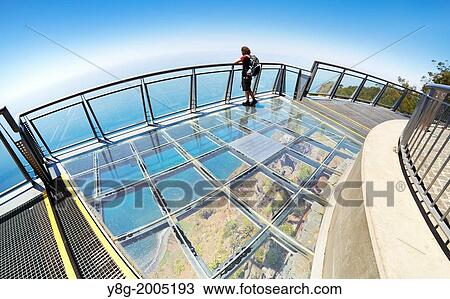 Tourist on the panoramic terrace (with glass floor) at the top of Cabo Girao (580 m highest) cliff - Camara de Lobos, Madeira, Portugal. View Large Photo Image Stock Image - Tourist on the panoramic terrace (with glass floor) at the top of Cabo Girao (580 m highest) cliff - Camara de Lobos, Madeira, Portugal.. Fotosearch