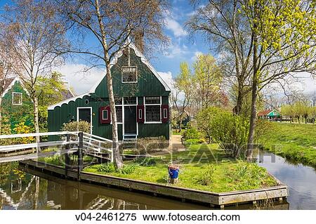 Stock Photography - Traditional house, little canal and picturesque bridge in the historic village of Zaanse Schans, The Netherlands, Europe. Fotosearch