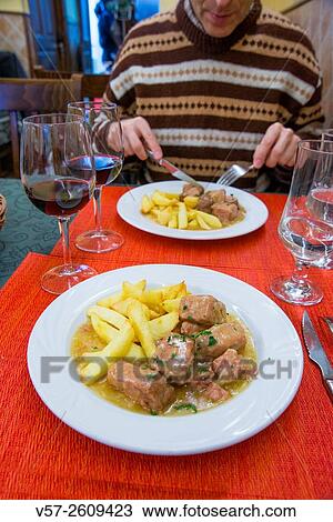 Tuna with fried potatoes and cider sauce in a restaurant. Madrid, Spain. View Large Photo Image Stock Image - Tuna with fried potatoes and cider sauce in a restaurant. Madrid, Spain.. Fotosearch