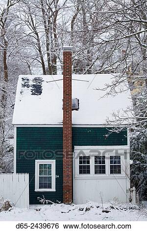 Stock Photograph - USA, Massachusetts, Cape Ann, Gloucester, early snow fall and small house.. Fotosearch