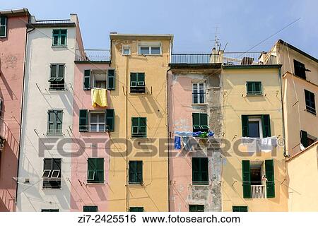 view of a row of historical traditional houses on embankment in a sunny spring day, Portovenere, Italy. View Large Photo Image Stock Photograph - view of a row of historical traditional houses on embankment in a sunny spring day, Portovenere, Italy.. Fotosearch