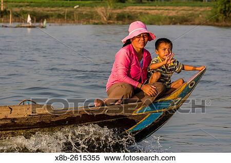 View of life along the Tonle Sap River headed towards Phnom Penh, Cambodia. View Large Photo Image Stock Photography - View of life along the Tonle Sap River headed towards Phnom Penh, Cambodia.. Fotosearch