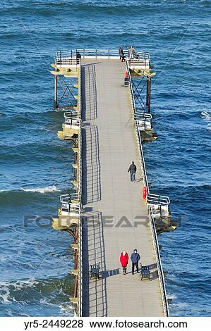 Stock Photo - View over Saltburn`s Victorian pier. Saltburn by the Sea, North Yorkshire, England, United Kingdom.. Fotosearch