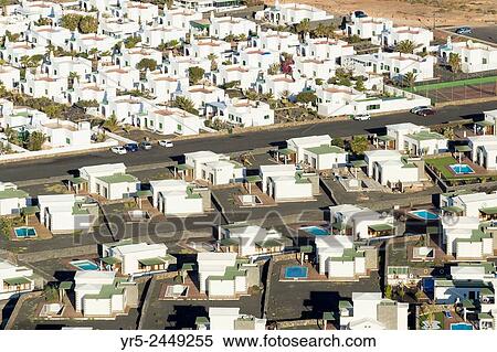 Stock Photography - View over villas at Playa Blanca on Lanzarote, Canary Islands, Spain.. Fotosearch
