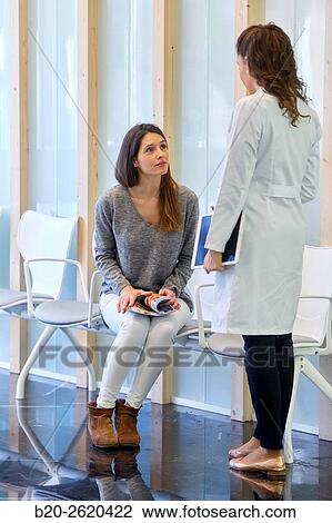 Waiting room. Doctor attending to patient medical consultation. Tablet. Office. View Large Photo Image Stock Image - Waiting room. Doctor attending to patient medical consultation. Tablet. Office.. Fotosearch