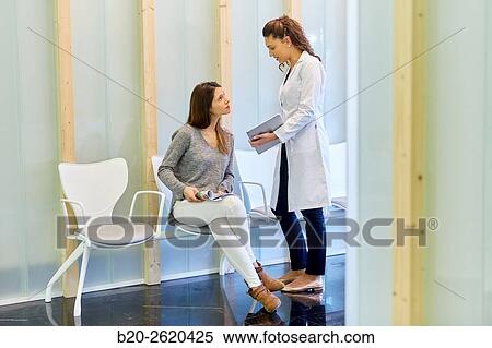 Waiting room. Doctor attending to patient medical consultation. Tablet. Office. View Large Photo Image Stock Photography - Waiting room. Doctor attending to patient medical consultation. Tablet. Office.. Fotosearch