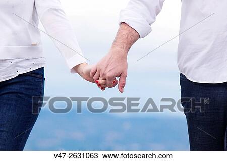 Wedding couple holding hands on the beach of Saler, Valencia, Spain, Europe View Large Photo Image Stock Image - Wedding couple holding hands on the beach of Saler, Valencia, Spain, Europe. Fotosearch