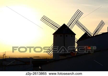 Wind mills at Campo de Criptana in evening time. La Mancha, Spain. View Large Photo Image Stock Photography - Wind mills at Campo de Criptana in evening time. La Mancha, Spain.. Fotosearch