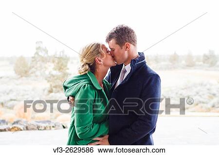 Winter portrait of a bride and groom in snow on their wedding day in Central Oregon. View Large Photo Image Stock Photograph - Winter portrait of a bride and groom in snow on their wedding day in Central Oregon.. Fotosearch