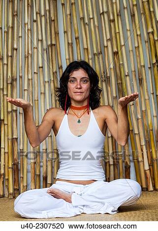 Stock Image - Woman doing yoga.. Fotosearch