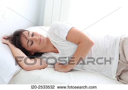 Woman in bed View Large Photo Image Stock Image - Woman in bed. Fotosearch