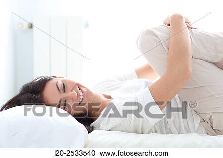 Woman in bed View Large Photo Image Stock Image - Woman in bed. Fotosearch