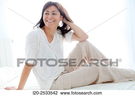 Stock Image - Woman in bed. Fotosearch