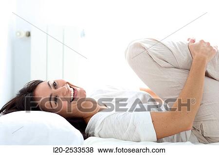 Woman in bed View Large Photo Image Stock Photo - Woman in bed. Fotosearch