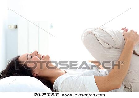 Woman in bed View Large Photo Image Stock Photo - Woman in bed. Fotosearch