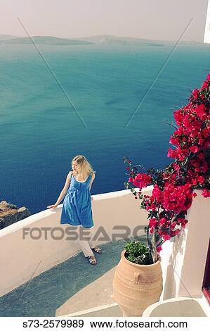 Woman in Oia, Santorini, Cyclades Islands, Greece View Large Photo Image Stock Photo - Woman in Oia, Santorini, Cyclades Islands, Greece. Fotosearch