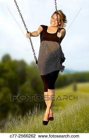 Woman on swing View Large Photo Image Stock Image - Woman on swing. Fotosearch