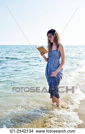 Woman on the beach View Large Photo Image Picture - Woman on the beach. Fotosearch