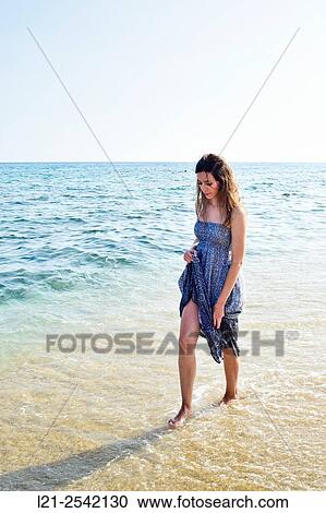 Woman on the beach View Large Photo Image Stock Image - Woman on the beach. Fotosearch