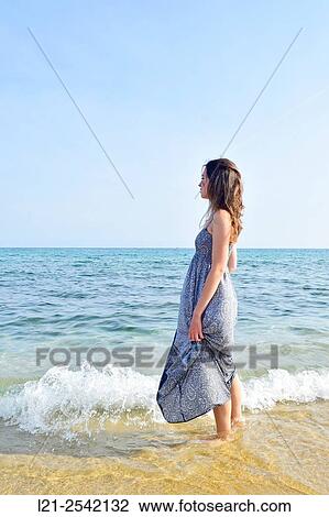 Stock Image - Woman on the beach. Fotosearch