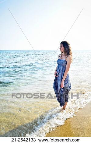 Woman on the beach View Large Photo Image Stock Image - Woman on the beach. Fotosearch