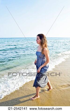 Woman on the beach View Large Photo Image Stock Image - Woman on the beach. Fotosearch