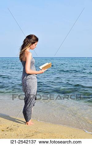 Woman on the beach View Large Photo Image Stock Photo - Woman on the beach. Fotosearch
