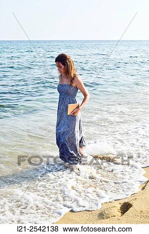 Woman on the beach View Large Photo Image Stock Photo - Woman on the beach. Fotosearch