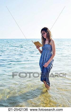 Woman on the beach View Large Photo Image Stock Photograph - Woman on the beach. Fotosearch