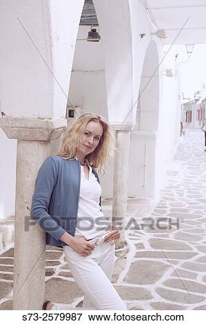 Stock Photo - Woman posing in Paros, Cyclades Islands, Greece. Fotosearch
