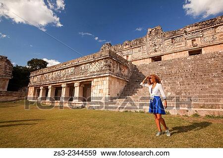 Woman posing in Uxmal Ruins near the Quadrangle Of The Nuns, Yucatan Province, Mexico, Central America. View Large Photo Image Stock Photo - Woman posing in Uxmal Ruins near the Quadrangle Of The Nuns, Yucatan Province, Mexico, Central America.. Fotosearch