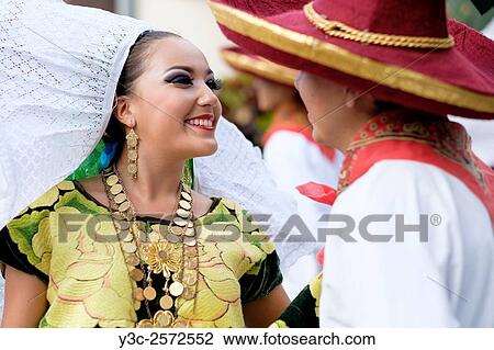 Woman smiling at man. Puerto Vallarta, Jalisco, Mexico. Xiutla Dancers - a folkloristic Mexican dance group in traditional costumes representing the culture and different regions of Mexico. View Large Photo Image Stock Image - Woman smiling at man. Puerto Vallarta, Jalisco, Mexico. Xiutla Dancers - a folkloristic Mexican dance group in traditional costumes representing the culture and different regions of Mexico.. Fotosearch