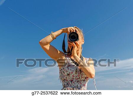 Woman taking pictures View Large Photo Image Stock Image - Woman taking pictures. Fotosearch