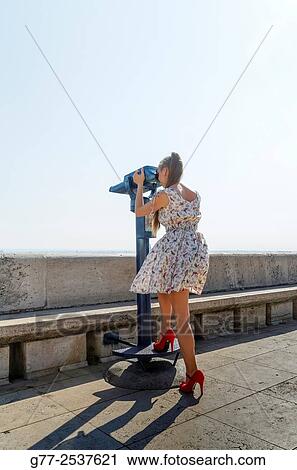 Woman using telescope. Budapest, Hungary View Large Photo Image Stock Image - Woman using telescope. Budapest, Hungary. Fotosearch