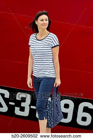 Woman walking in the fishing port. Getaria. Gipuzkoa. Basque Country. Spain View Large Photo Image Stock Image - Woman walking in the fishing port. Getaria. Gipuzkoa. Basque Country. Spain. Fotosearch