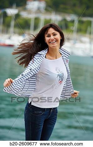 Woman walking in the marina. Port. Getaria. Gipuzkoa. Basque Country. Spain View Large Photo Image Stock Photo - Woman walking in the marina. Port. Getaria. Gipuzkoa. Basque Country. Spain. Fotosearch