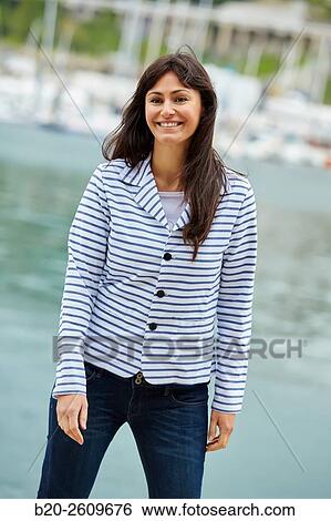 Woman walking in the marina. Port. Getaria. Gipuzkoa. Basque Country. Spain View Large Photo Image Stock Photograph - Woman walking in the marina. Port. Getaria. Gipuzkoa. Basque Country. Spain. Fotosearch